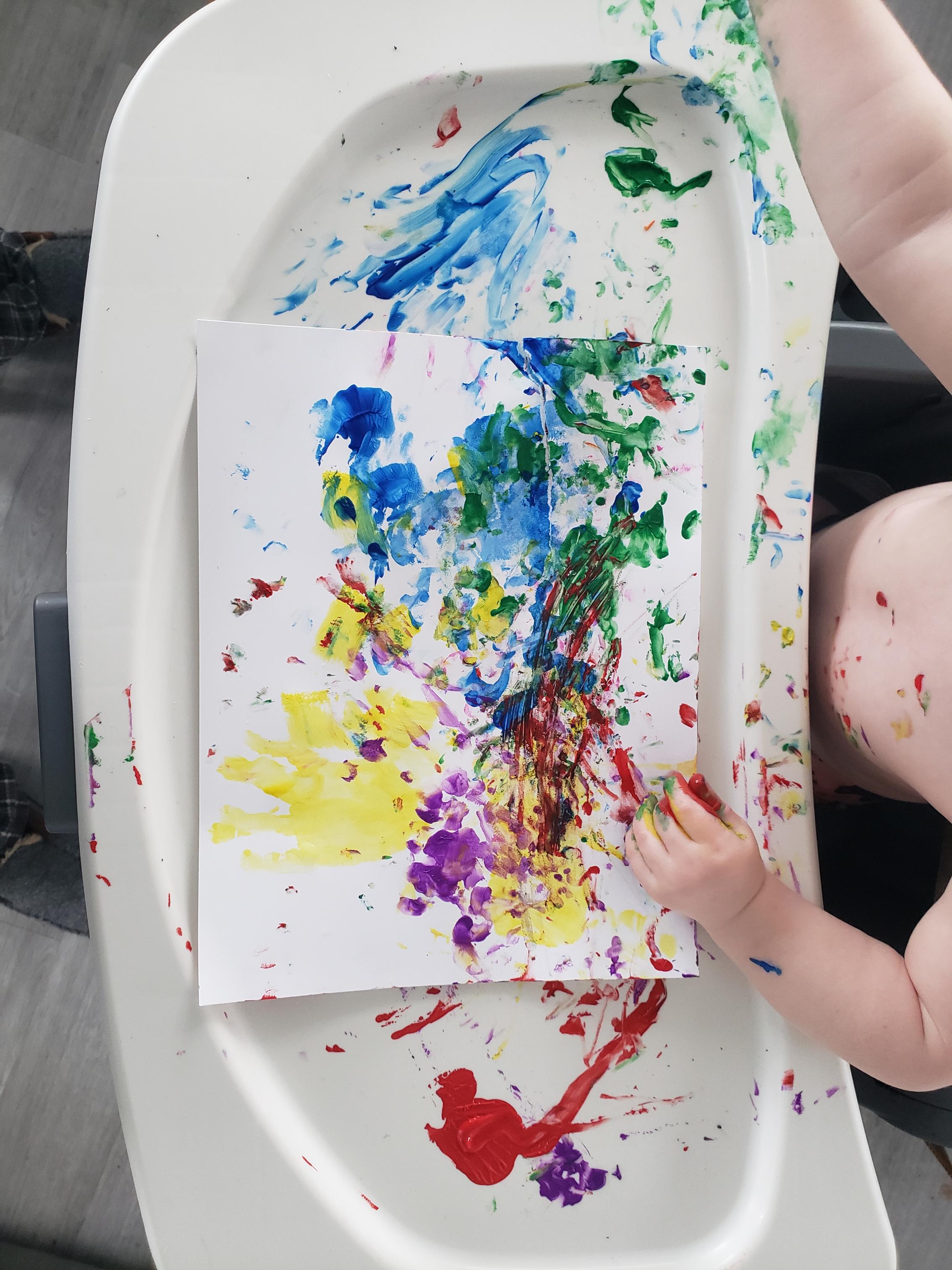 Colorful sensory toys and textures in a bucket.