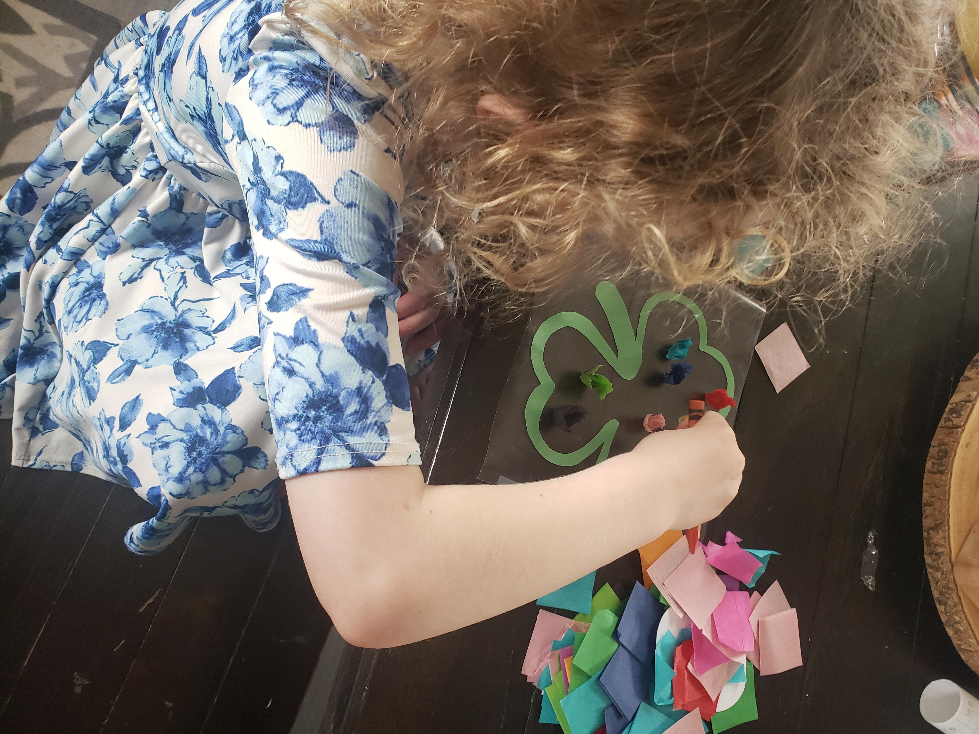 Child exploring sensory materials.