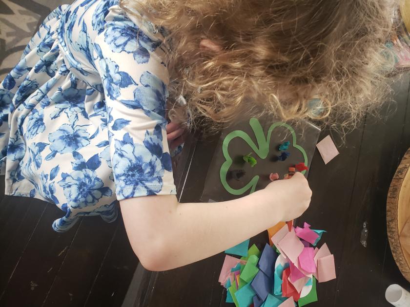 Child exploring sensory materials.