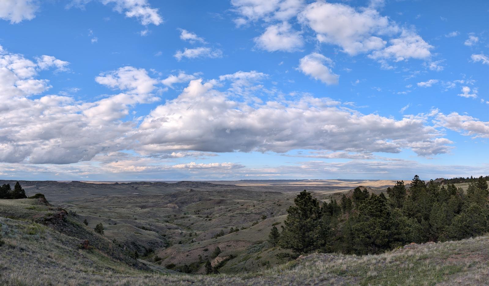 Wide view over the rolling Montana prairie and coulees surrounding the homestead